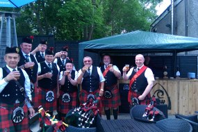 The Pipe Band enjoys their reward.