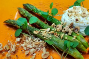 English Asparagus with truffle emulsion and roasted hazelnuts