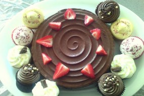 chocolate fudge cake topped with strawberries