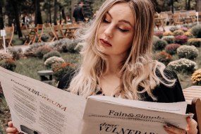 Amidst the comforting buzz of the coffee shop, she enjoyed the morning stillness with a newspaper in hand. In the aroma of freshly brewed coffee, each article unfolded like a miniature adventure. This has become her peaceful escape from the world. ☕️  Location: Republic Of Moldova Place: Bonjour Cafe Month: October 2023.