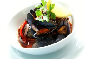 Mussels cooked in a spicy African sauce taste of Afica