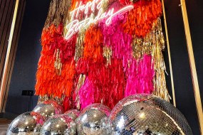 Tassel Wall with neon light and disco balls!