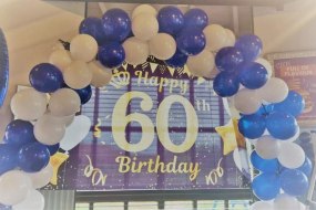 Our 60th backdrop with balloon aches