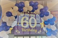 Our 60th backdrop with balloon aches