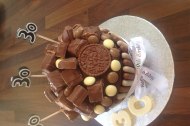 Giant chocolate cupcake with chocolate bars on the top 