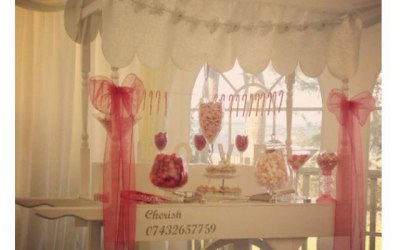 Vintage Candy Cart filled with sweets, bags and bows.