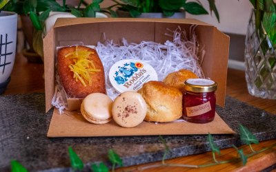 My sweet afternoon tea selection including, vanilla scones, Rachell Bakes jam, Rodda's clotted cream, lemon drizzle loaf and miniature salted caramel and coffee macarons.