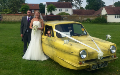 Happy couple with Only Fools and Horses van