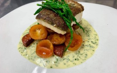 Pan roasted cod with samphire, sautéed choritzo, potato and cherry tomatos with a parsly sauce