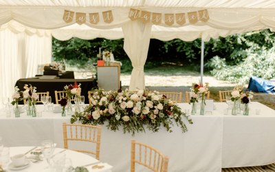 Luxury marquee wedding breakfast set with head table