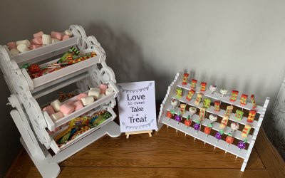 Ferris Wheel with lollipop stand and love is sweet sign