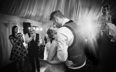 Bride and groom kissing at first dance