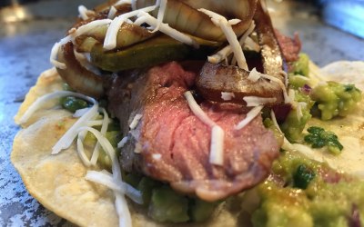 Pink steak, Oaxaca cheese, guacamole and balsamic onions.