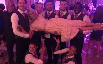 Dancing waiters at a wedding