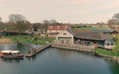 Bride arriving by Boat in Norfolk