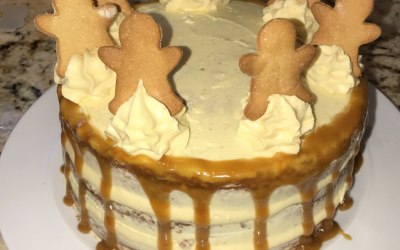 A ginger sponge with vanilla buttercream, homemade orange caramel drip and homemade gingerbread men.