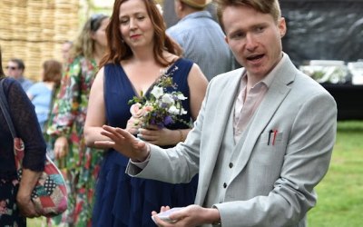 Performing close up magic at a beautiful woodland wedding.