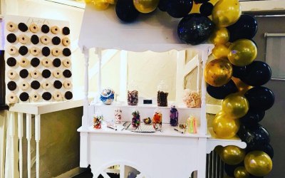 Candy cart with organic balloon garland