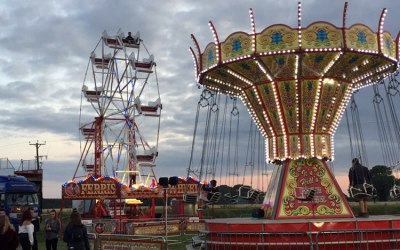 vintage ferris wheel and adult chair o planes at we out here music festival a frim family favourite 