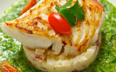 Hake on roasted potatoes and cream pesto