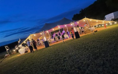 20 x 15m stretch tent at night - Hampshire