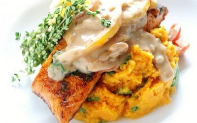 seared salmon atop sweet potato mash peanut sauce