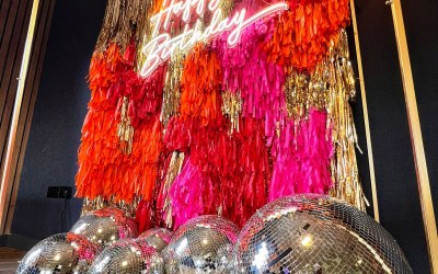 Tassel Wall with neon light and disco balls!