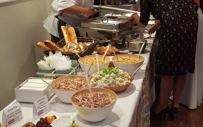 Deli Truck buffet table for 130 guests, 3 hot dishes, 2 hot sides, salads, terrines, pates, cheeses and breads.