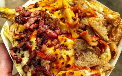 Dirty fresh chips with special sauce and cheese, bacon 