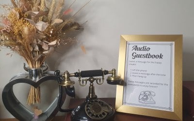 Black Vintage Audio Guestbook phone with a gold frame.