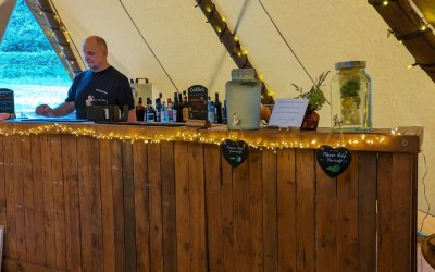 Rustic Bar set up to fit inside a tipi.