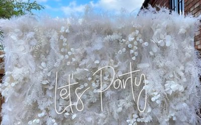 Beautiful White Floral & Pampas Wall Available to hire in 2 sizes. A beautiful addition to weddings, baby shower and birthday parties a real  statement display can also be paired with balloon colours of your choice neon sign and personalised acrylic sign. Message me for Hire prices.