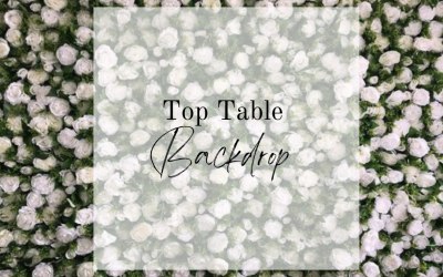 Top table backdrop green foliage and white roses and peonies 