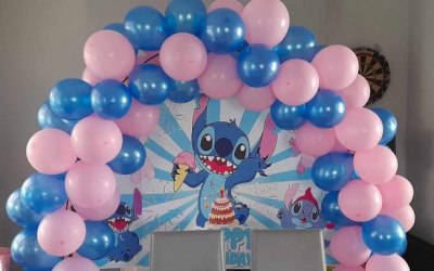 Our stitch backdrop with balloon aches