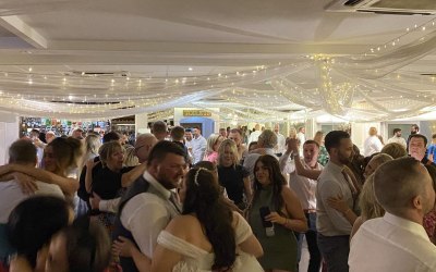 Bride and Groom Enjoying Dances With Their Friends and Families