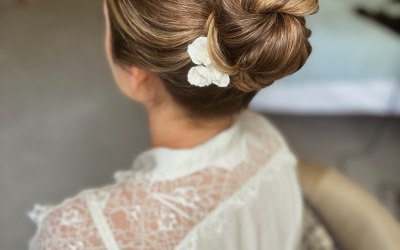 Gorgeous bride Hannah opted for a sleek, modern mid bun for her first wedding look