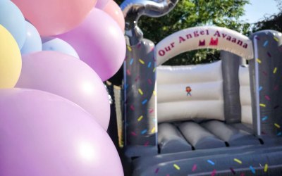 10 by 12 ft Grey and white bouncy castle 