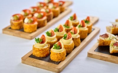 Canapés with edam cheese,baby tomatoes,cream cheese ,glazed balsamic vinegar and curly parsley 