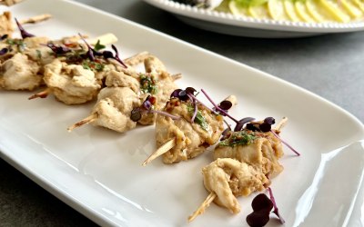 bang bang chicken skewers - dressed side of salmon in the background