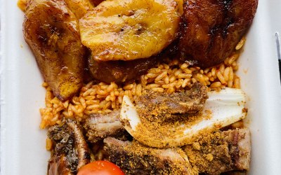 Our fluffy jollof rice topped with beef suya, jerk chicken, plantain, mac n cheese