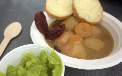 Stew, crusty bread and mushy peas 