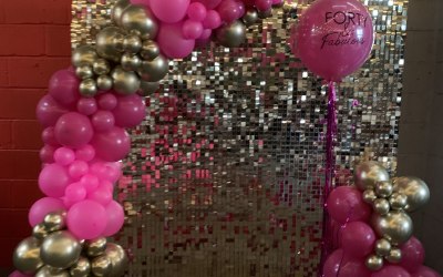 Balloon garland and gold shimmer wall 