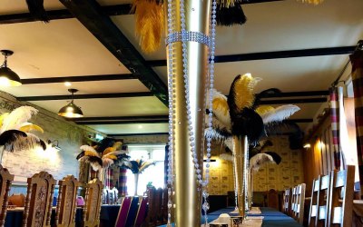 Gold vase, feathers centrepiece 