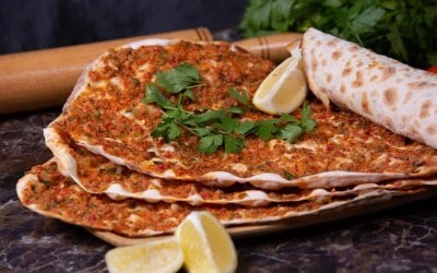 Lahmacun (Turkish flatbread topped with Minced Lamb, herbs & spices)