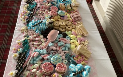 Christening sweet table very colourful as requested