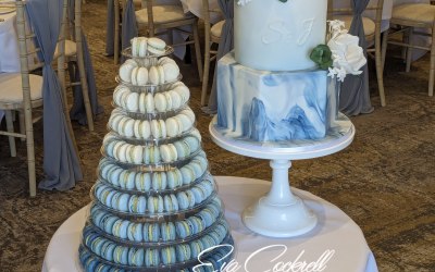 White and blue cake with macaron tower 