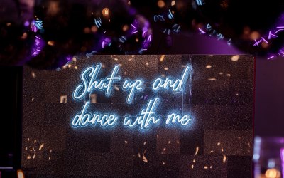 Silver glitter wall & neon sign