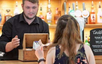 Serving drinks at the bar