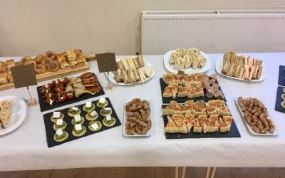 full-finger-buffet-laid-out-on-crockery-paddle-slate-with-signage-main-photo-b.jpg