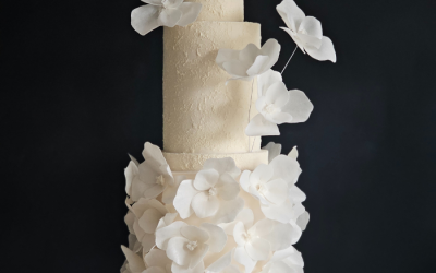 Textured ivory wedding cake with abstract flowers